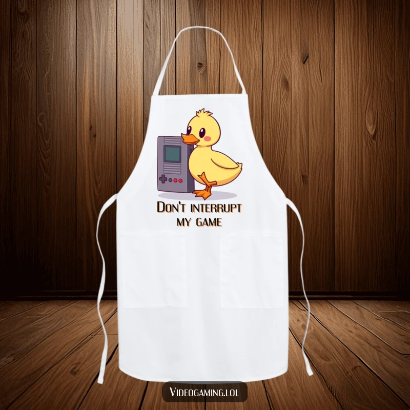 Funny wobbly duck apron, hilariously balancing a vintage game cartridge while cooking, a humorous kitchen accessory for gamer chefs.