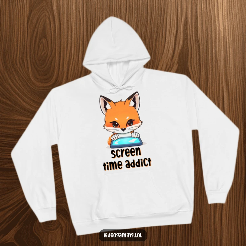 Funny Fox Stare Hoodie showing a curious fox peering intently at a glowing screen, radiating quiet fascination.