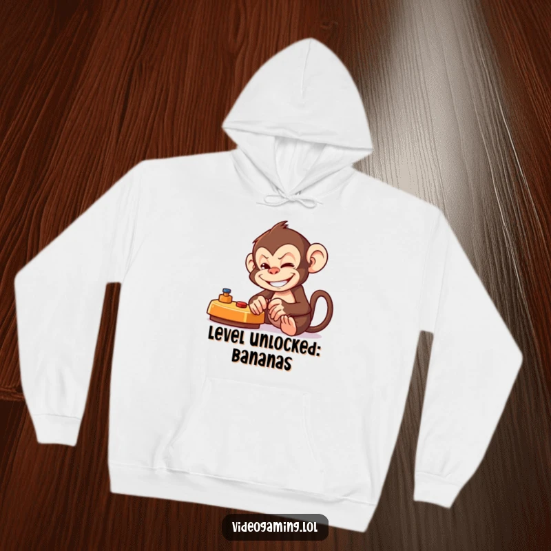 Funny Monkey Gamer Hoodie with a mischievous monkey intensely playing a game, showcasing a wide, playful grin.