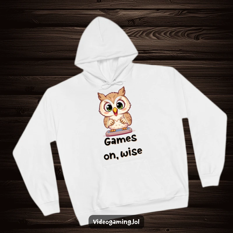 Funny Owl Hoodie: A joyful owl plays a game with wide, focused eyes, offering cozy warmth and gamer dedication.