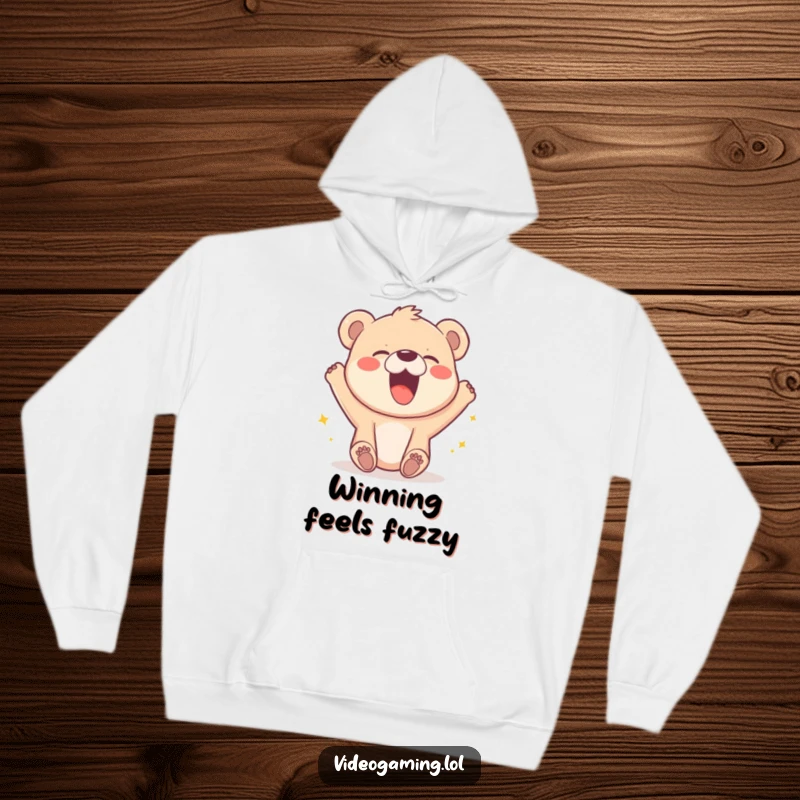 Funny hoodie with a cute bear cub roaring with laughter over a pixelated character's video game win.