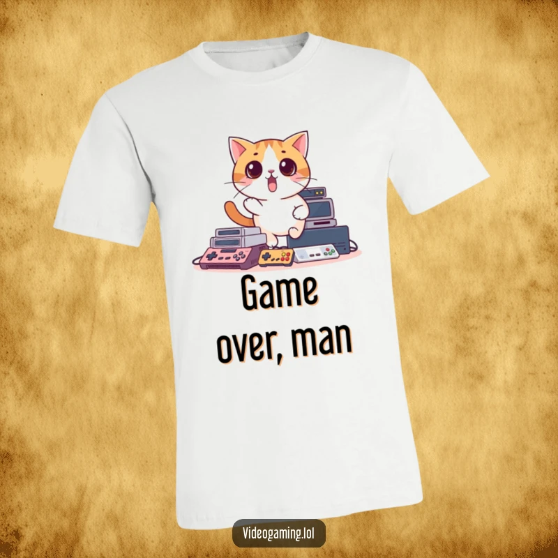 Funny t-shirt with a surprised cat comically falling over a mountain of video game consoles, embodying gamer struggles humorously.