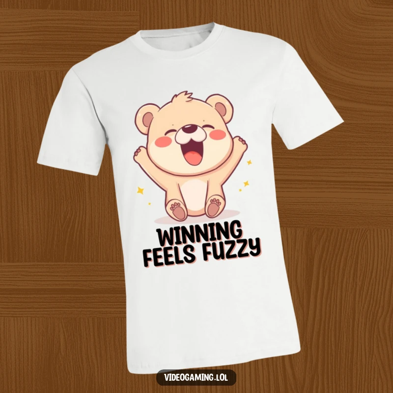 Funny t-shirt featuring a happy bear cub roaring with laughter as a video game character wins.