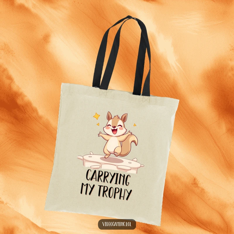 Funny tote bag illustrated with an excited squirrel dancing triumphantly after clearing a game level, gamer accessory.