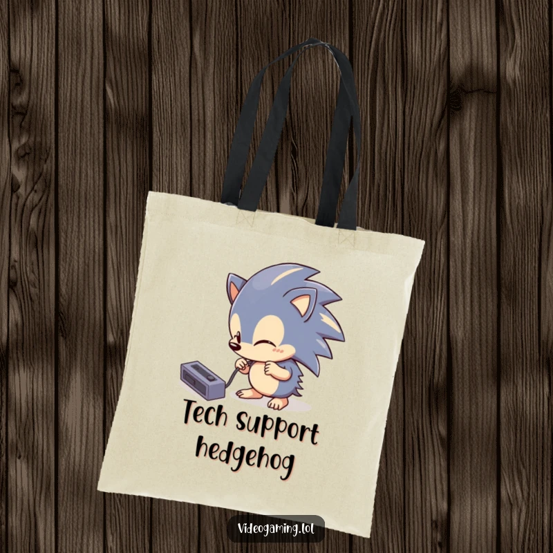 Funny Hedgehog Tech Tote Bag showcasing a curious hedgehog comically attempting to plug in a console cable, symbolizing tech challenges.